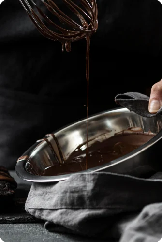 Photo of raw chocolate flowing into a bowl